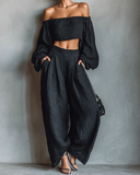 Conjunto de top negro con hombros al descubierto de manga larga y pantalones de pierna ancha