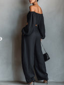 Conjunto de top negro con hombros al descubierto de manga larga y pantalones de pierna ancha